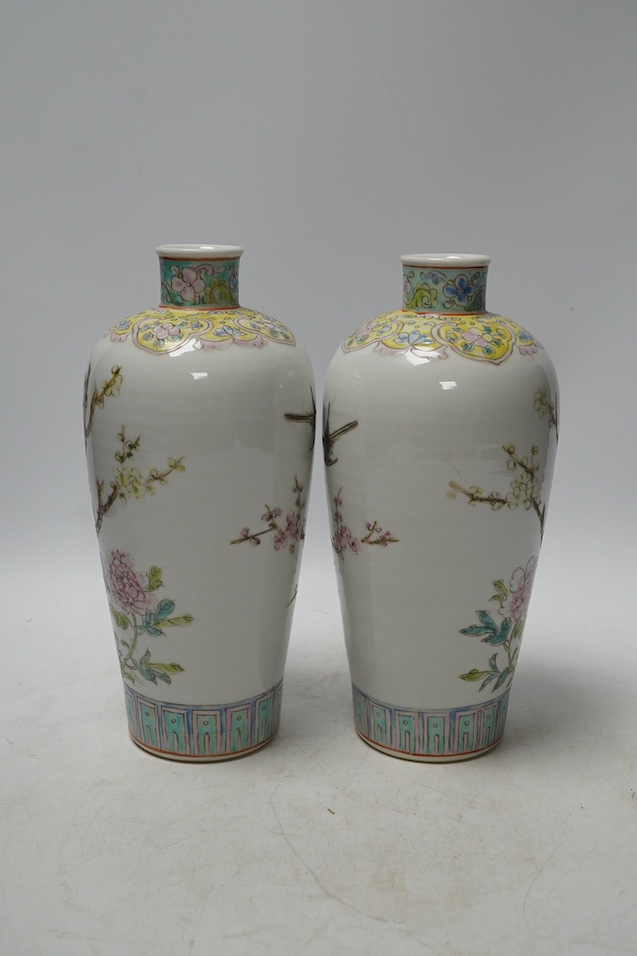 A pair of Chinese famille rose tapering vases, Qianlong mark but later, 23cm. Condition - good